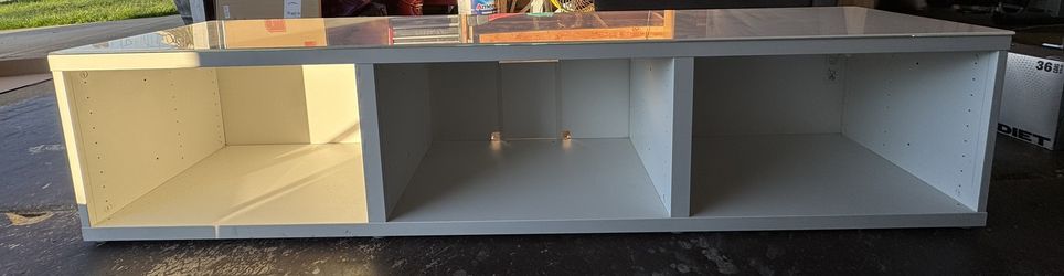 White Besta TV Stand with white glass top. 71”Lx16”Wx16”H