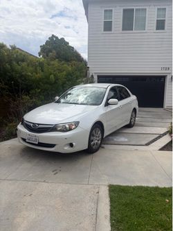 Subaru Impreza white sedan