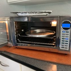 Cooks convection oven, heats up to 450 degrees. Pans included