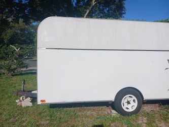 Enclosed work trailer with shelves