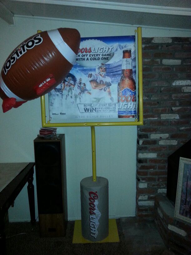 Coors Light football field goal post w/inflatable football