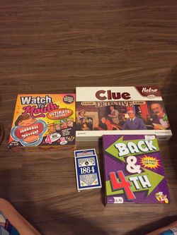 3 unopened board games and giant deck of cards