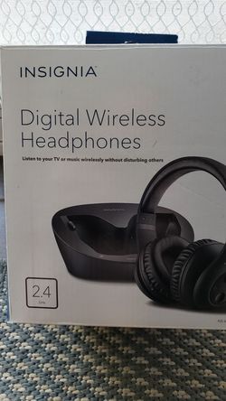 New (in box) Insignia wireless headphones with charging station