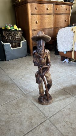 Carved man with cane