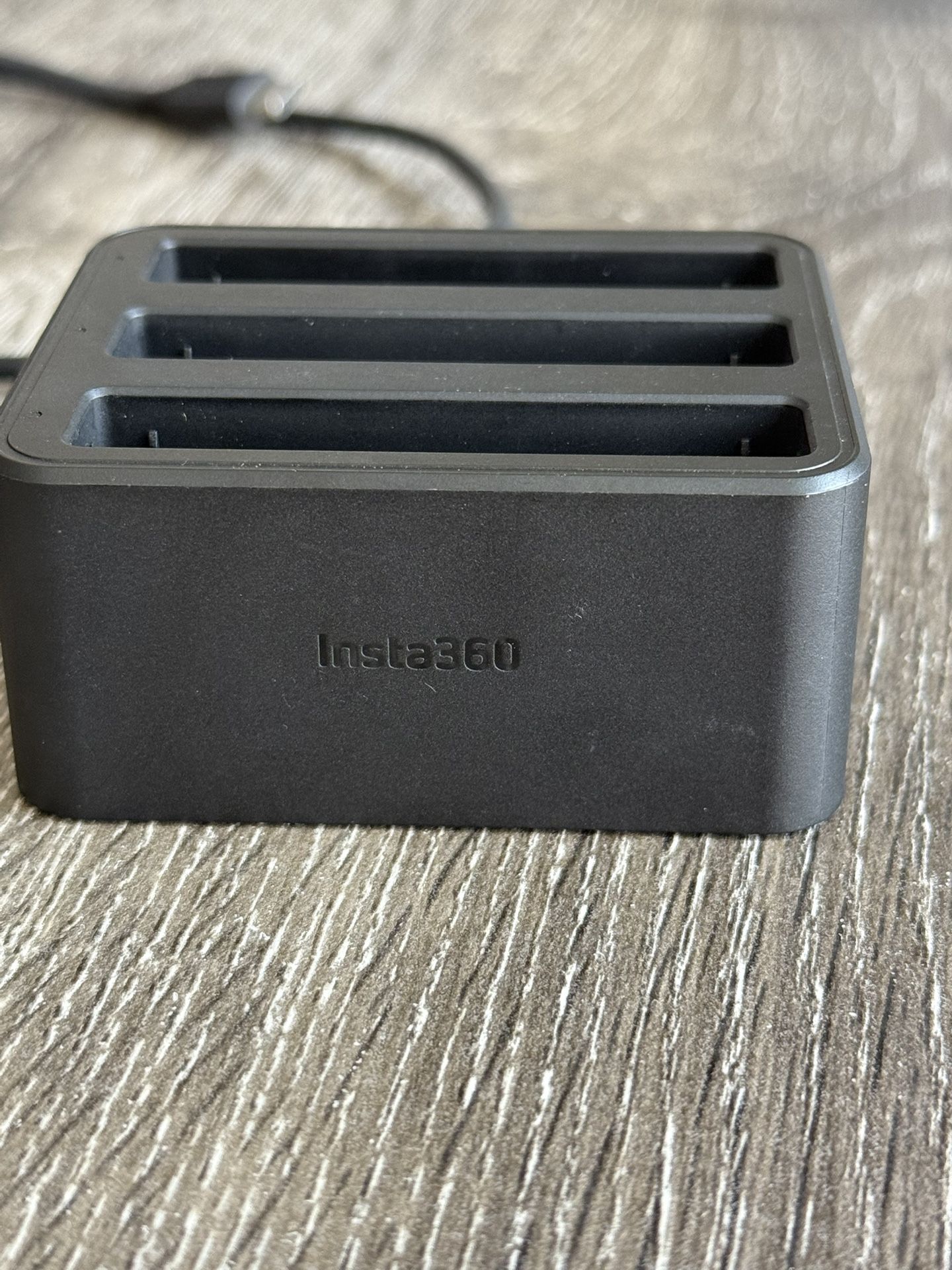 Insta 360 X4. Two battery charging units.