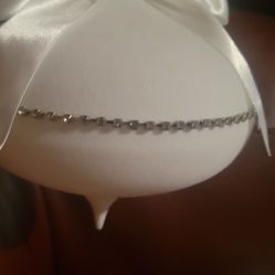 white satin or fabric-wrapped ornament, likely intended for a wedding or special occasion. 
