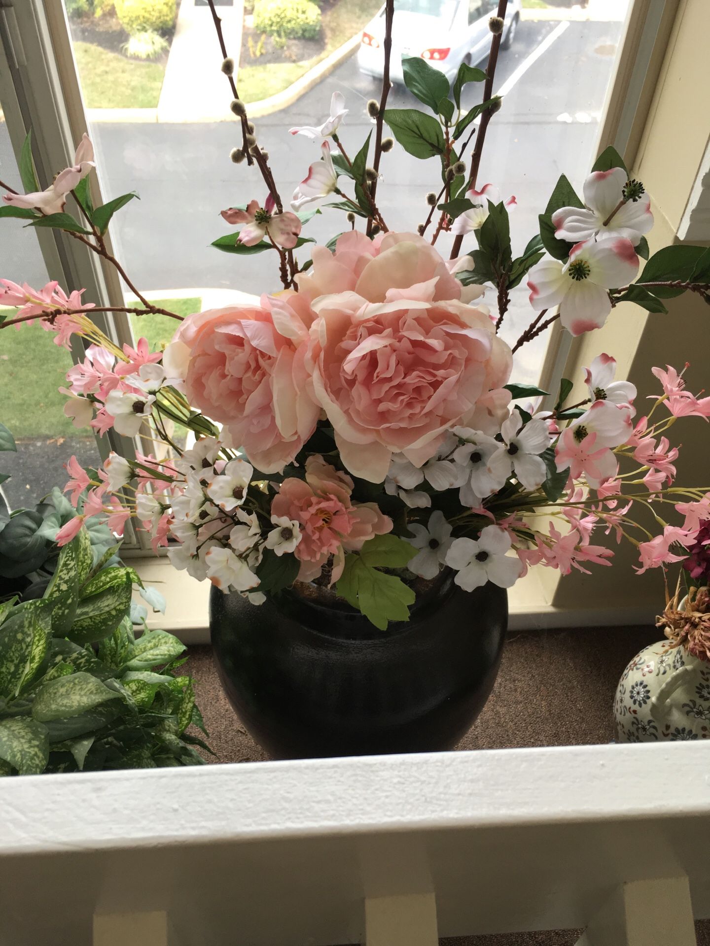 Faux flower in floor vase