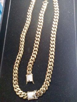 New 14 k yellow gold Cuban chain and bracelet