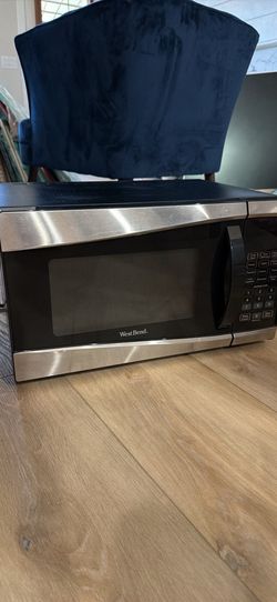 Like new black and silver microwave