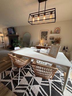 White Dining Table with Rattan Chairs