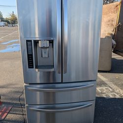 LG 4 door refrigerator/3 months of warranty and free local delivery