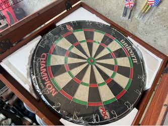 Brand new Unicorn Champion dartboard with cabinet