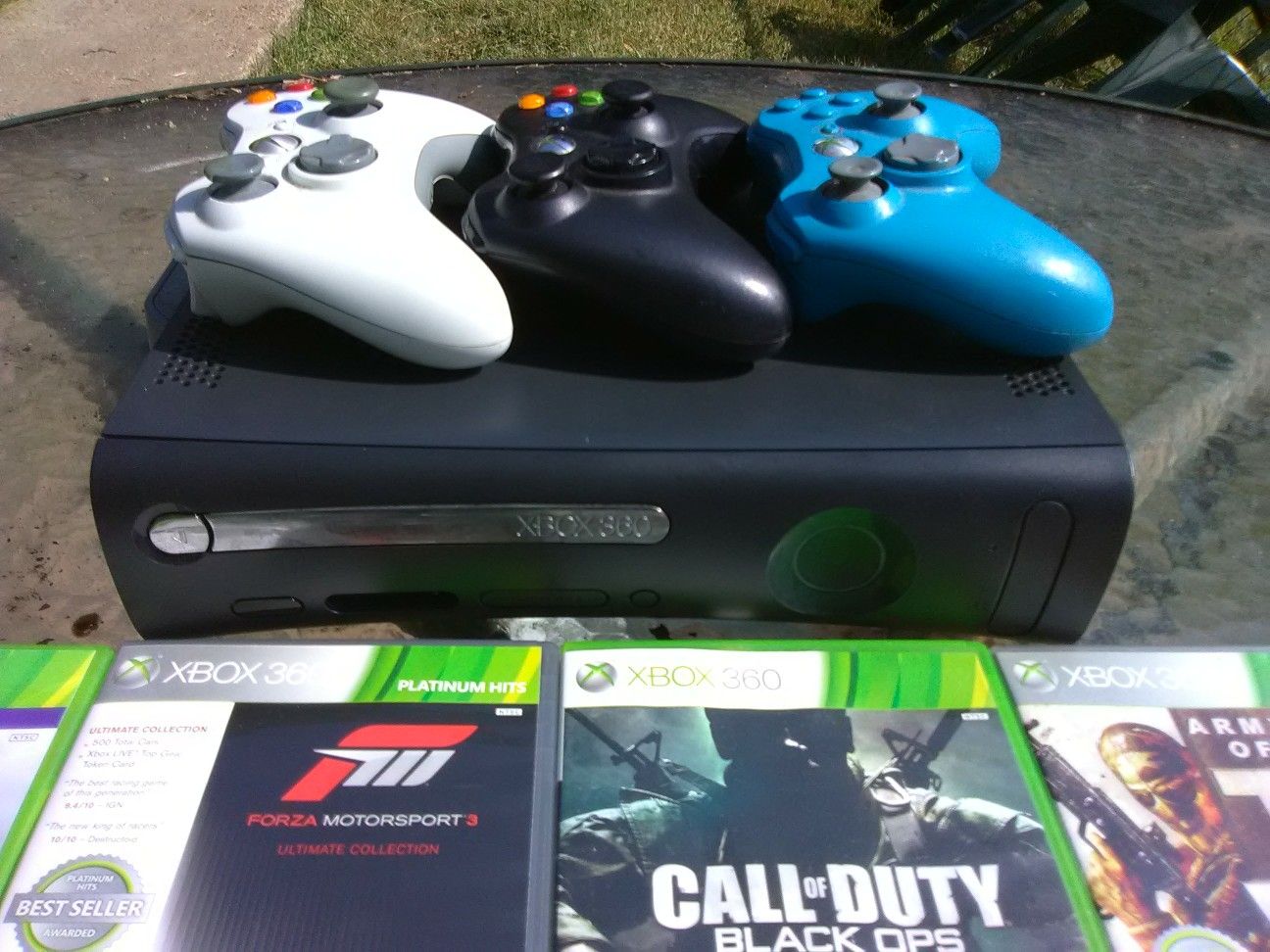 Xbox 360 console only with power brick and 3 controllers with no battery packs