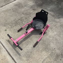 Pink hoverboard with go cart attachment