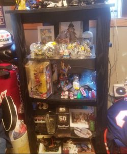 Black hardwood TV stand with extra shelves.