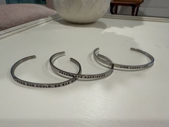 MantraBand bracelets - silver - $40 for the set or $20 a piece.