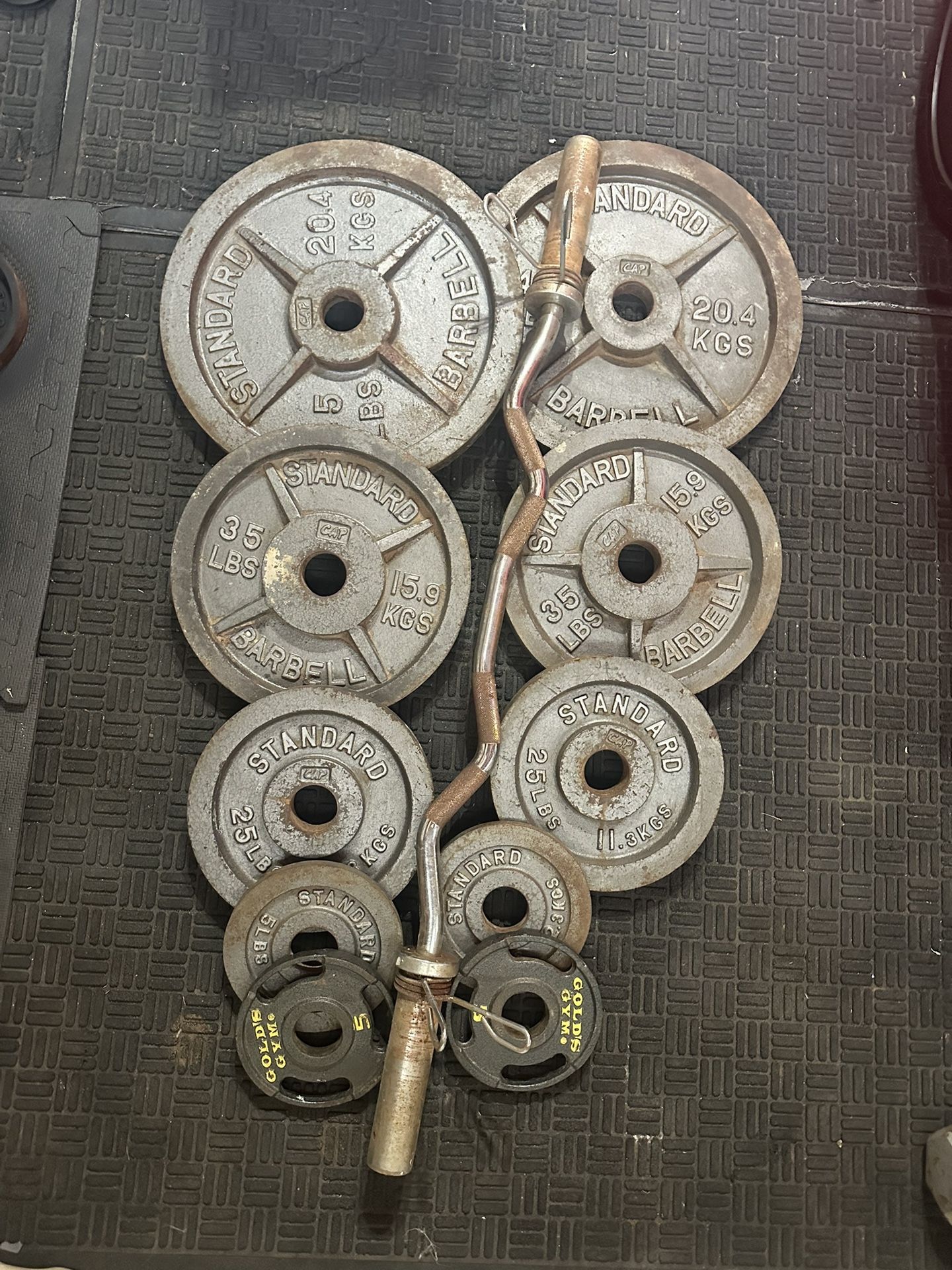 Olympic weights 230lbs total plus curl bar