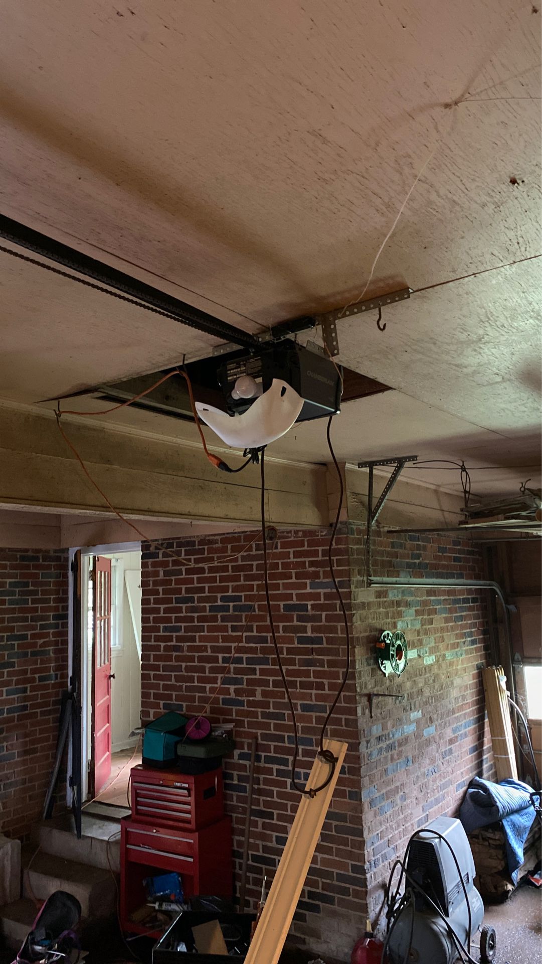 Chamberlain single car garage door opener like new installed and the door was too heavy must come here and take it down no remote and the door was t