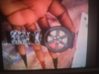 I have band new men watch make with steel car rims style band new with a box