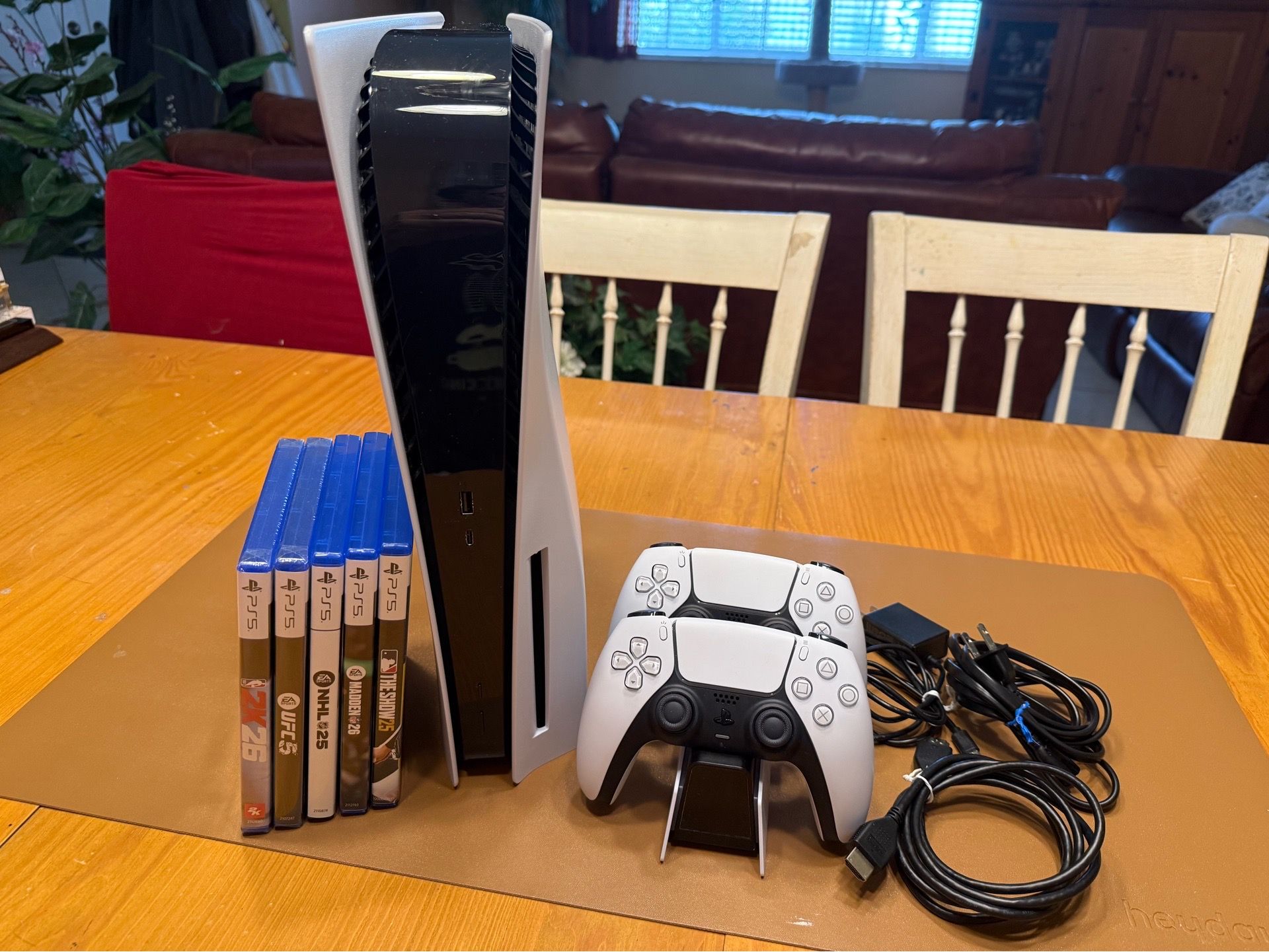 PlayStation 5 Console (Disc Version) Sports Bundle. Includes console, 2 controllers, charger, cords, and 5 games!!
