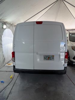 White Cargo Van with Florida Plates