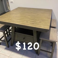 Solid wood dining table with four chairs