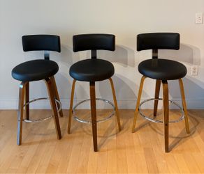 3 brown and black bar stools