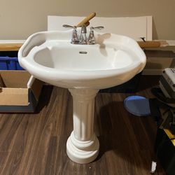 Porcelain Pedestal Sink With Chrome Moen Faucet