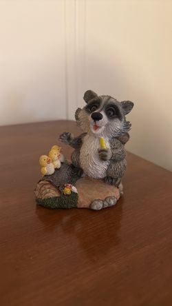 Raccoon & duck figurine