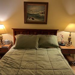 Queen Size Bed With End Tables and a Chest Of Drawers 
