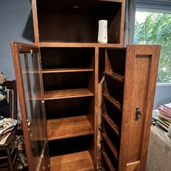 Its A Cabinet With Shelfs Inside With Glass Door Brown 