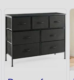 black 7-drawer fabric storage dresser featuring a dark wood-grain top and a sturdy metal frame.