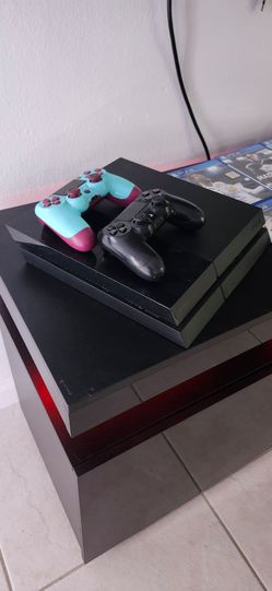Sony PlayStation 4 Console with Two Controllers