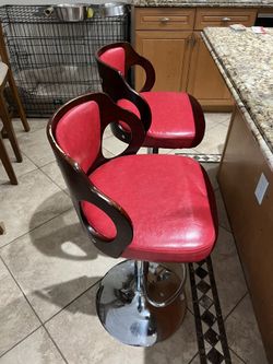 Two RED adjustable Barstools 