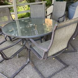 Outdoor Glass Top 60” Rnd Table & 6 Delux Chairs