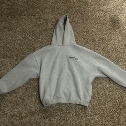 Grey Fear of God Essentials hoodie Side pockets