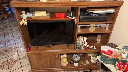 Flat Screen TV in Wood Entertainment Center