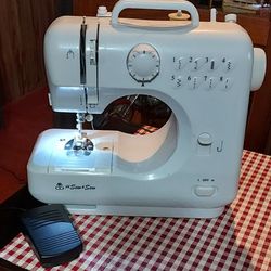 Like New Sewing Machine In Excellent Condition,  100.00 
