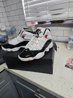 Brand new AI Overview    +6                    The shoes in the image are the Jordan 6 Rings "Chicago Bulls" (style code: 322992-164).