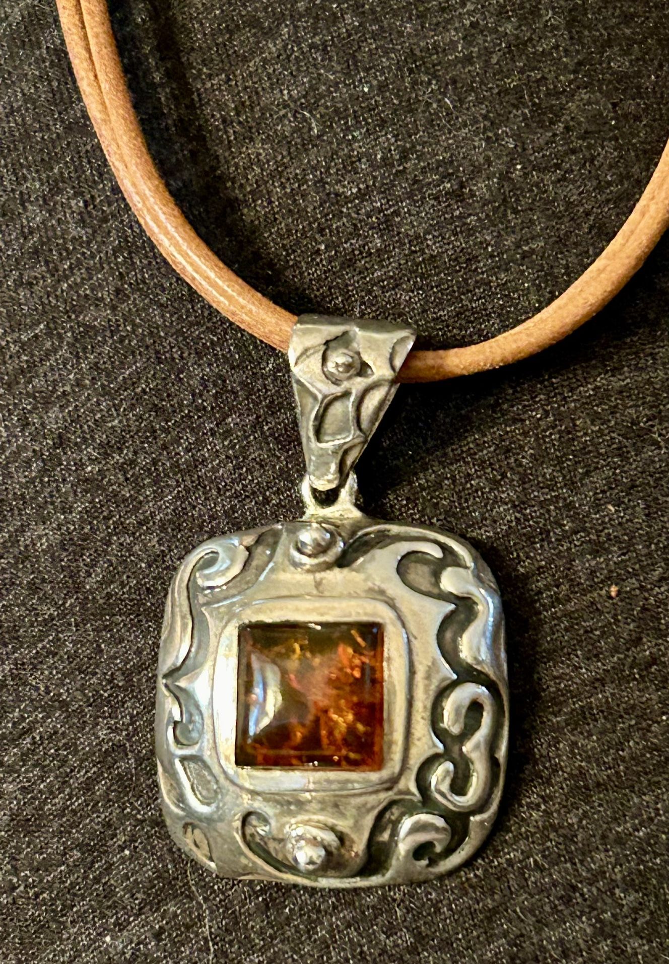 Retired Silpada sterling and amber pendant on leather cord