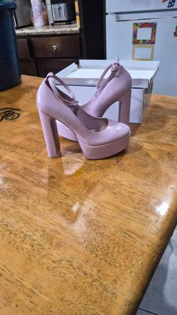 Aldo Fonda pink patent platform block heels featuring an ankle strap and rounded toe