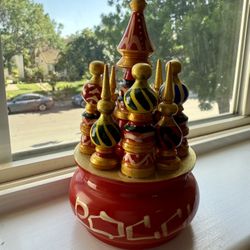 This is a hand-painted wooden model of Saint Basil's Cathedral, located in Moscow's Red Square.