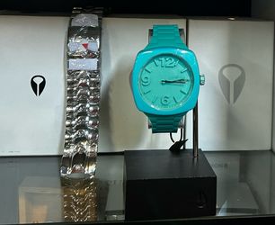 Green Nixon watch freestyle, electric Fitbit at Catch a Wave Surf Shop