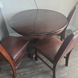 Round Top Table With Four Chairs