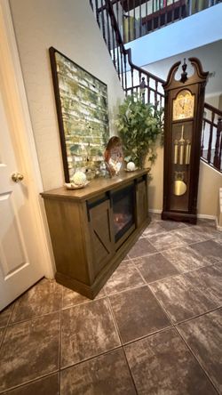 Beautiful rustic fireplace/tv stand in excellent condition with barn doors 60"