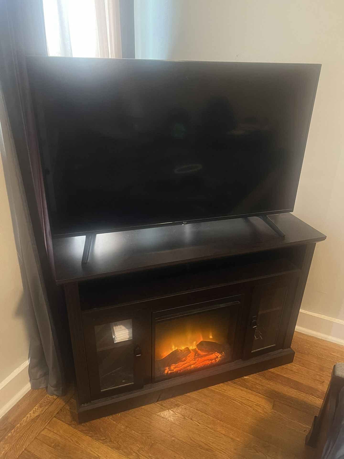 Wooden Fireplace & 55” TV