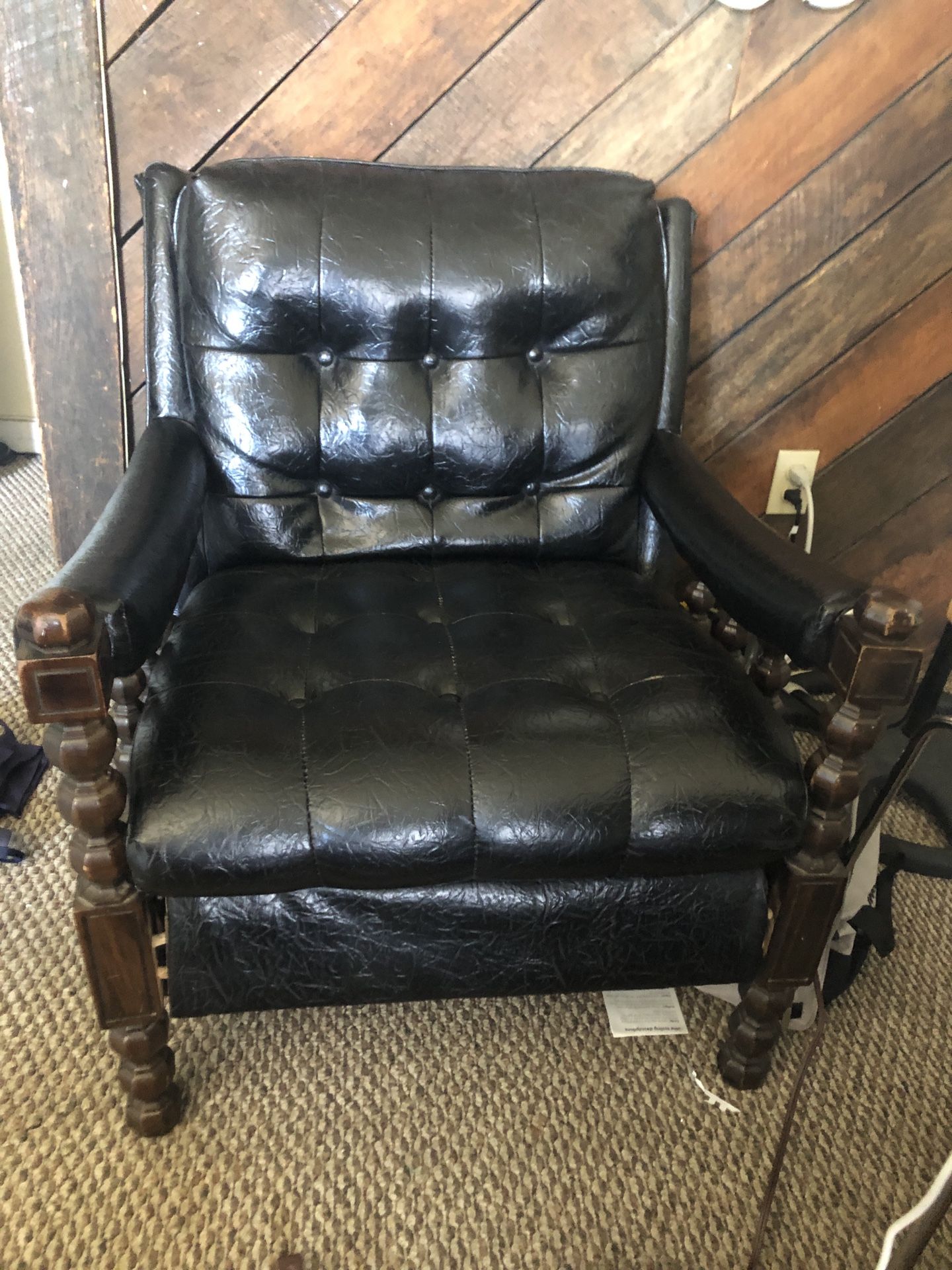 Black, tuffted, leather chair