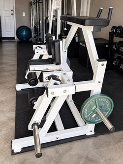 Heavy-duty commercial-grade plate-loaded hamstring machine in excellent condition.