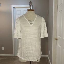 A Love Store Brand Women’s size medium NWT top in white with rhinestone embellishments at neckline.