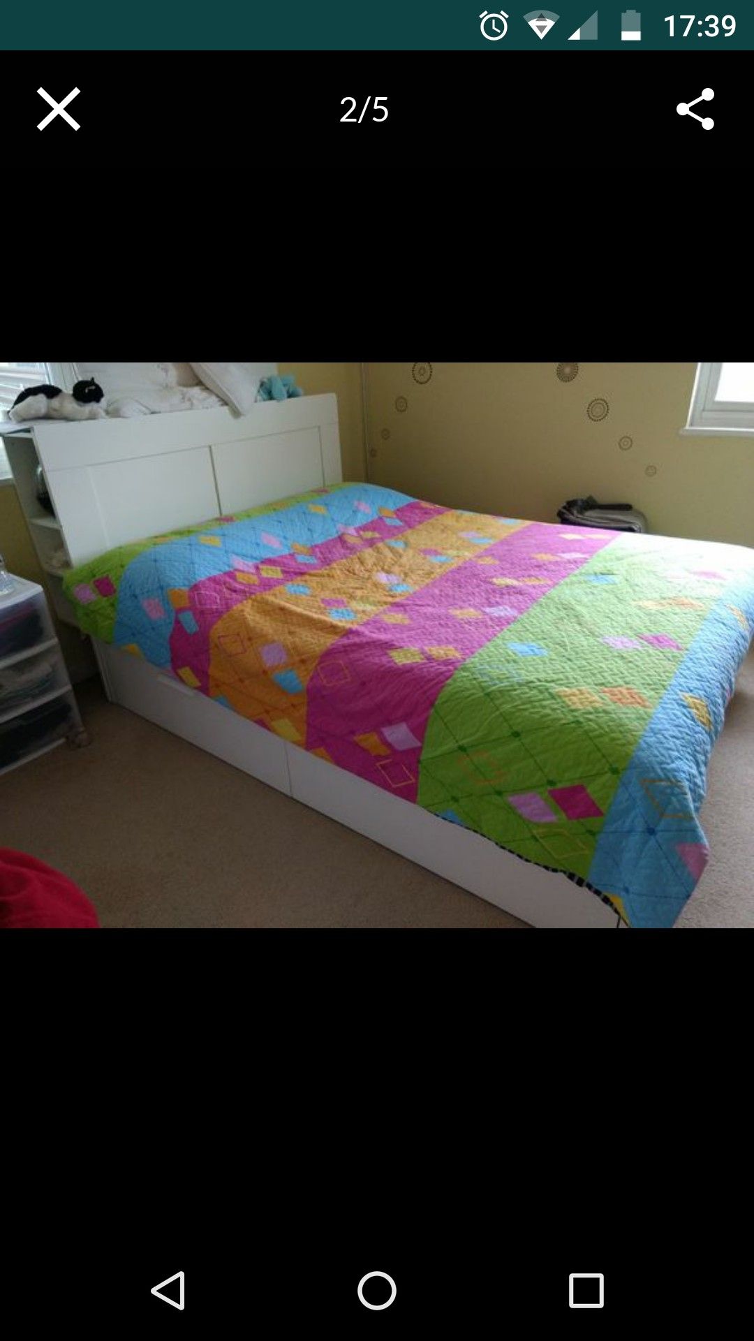 White bed with headboard and 4 storages